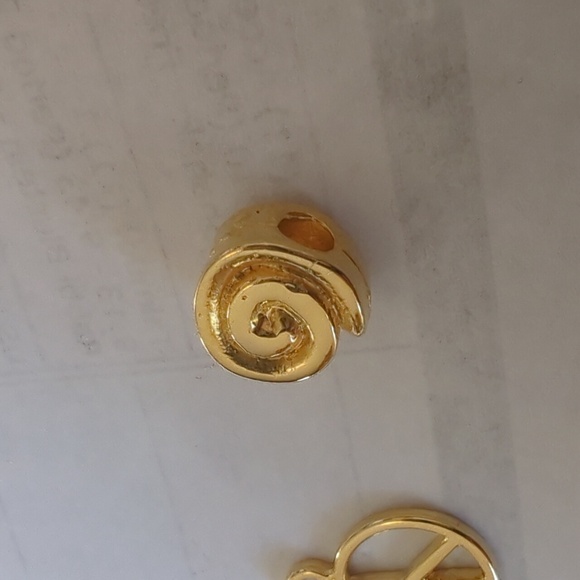 Four gold necklace charms. Peace, music note, little price, and swirl. Charms! - Picture 8 of 8